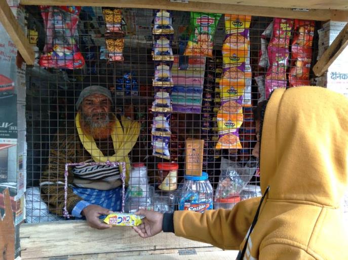 Mansoor Ahmed Farooq confidently selling wares in his shop