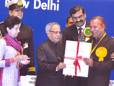 Mr. J.L. Kaul receiving the Best Braille Press Award from the President of India on 6th February, 2013