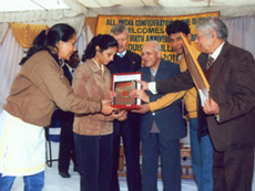 Ms. Zarana Dilipkumar Maheshwary receiving Krishan Kumari Varma Memorial award for topping the University in her subject at a public function organized by All India Confederation of the Blind on the occasion of 202nd Birth Anniversary of Louis Braille